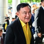 Thai ex-PM Thaksin lands in Bangkok ahead of crucial court date